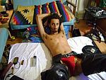 JD James in a red jockstrap and Chaps