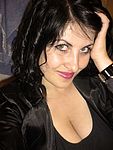 Dark hair, green eyes, soft pink lips.....