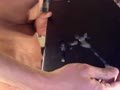 Naughty boy blows a creamy load on a black pad so you can really see it